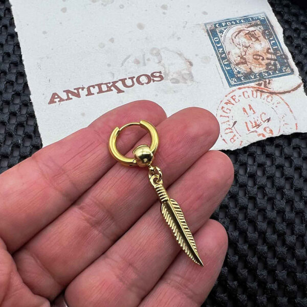 Gold feather earring and vintage postal stamp